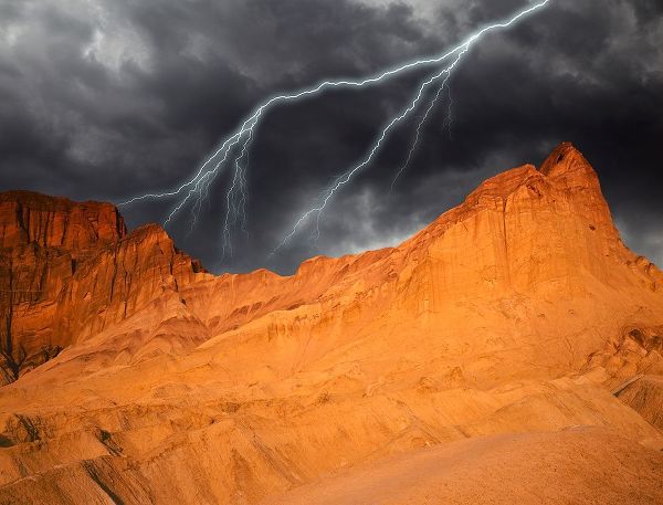 California-Death Valley National Park Composite of lightning over Golden Canyon at sunset